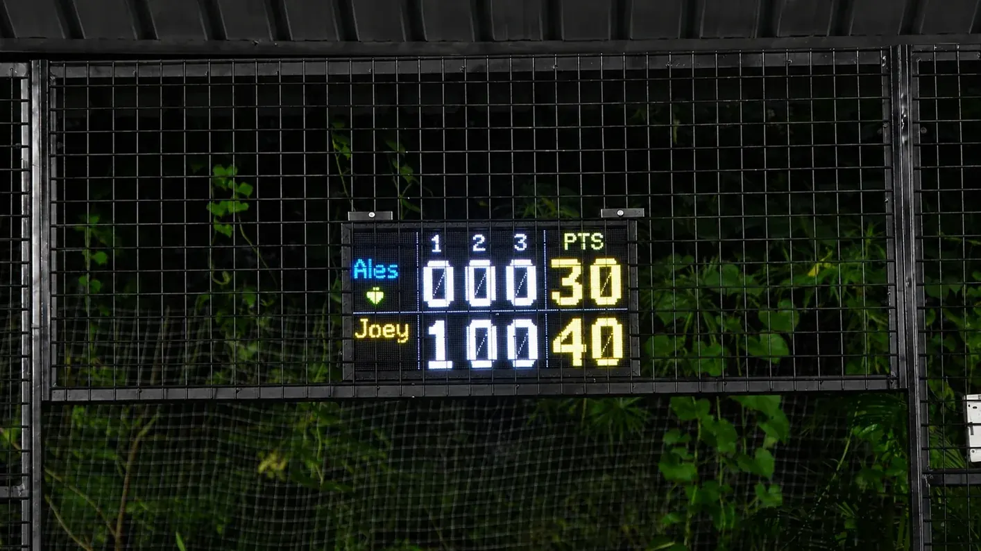 A Tovio board mounted courtside, showing the live game score