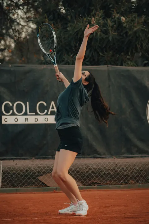 Tennis player preparing to serve