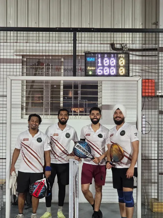 A padel four in club colours after their match